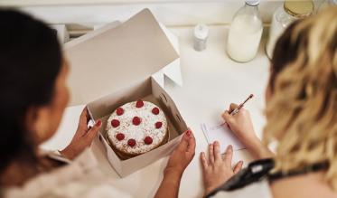 Women discussing starting a cake business